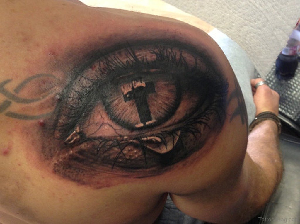 Cross Eye Tattoo On Back Of Shoulder